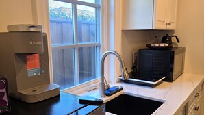 A kitchen with a Keurig coffee maker, a microwave, and a sink. - Private In-Law Suite with Kitchenette in Sunnyvale next to Park (Sunnyvale)