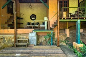 A staircase leading to a second-floor balcony with a view of the surrounding area. - Sama Retreats (Galle)