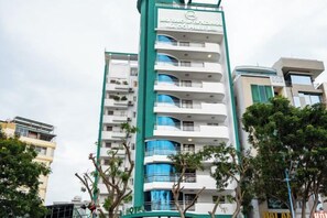 A multi-story hotel with a prominent sign, balconies, and a modern architectural design. - Big Hotel Vung Tau (Vung Tau)