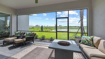 Smart TV, fireplace, books, computer monitors