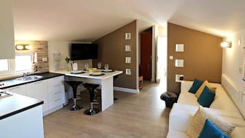 Villa (Six Bedroom Villa With Heated Pool) | Living room | 32-inch flat-screen TV with satellite channels