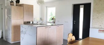 Spacious apartment in a unique location by the forest with fantastic views.