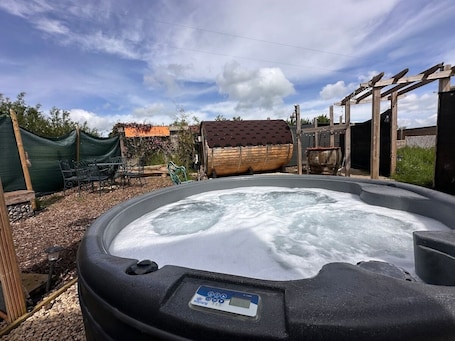 Outdoor spa tub. Shepherds Retreat in Meadow +Spa
