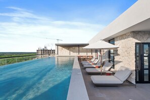 2 outdoor pools, pool umbrellas, sun loungers