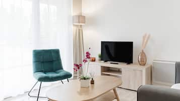 Suite, varias camas, no fumadores | Zona de estar