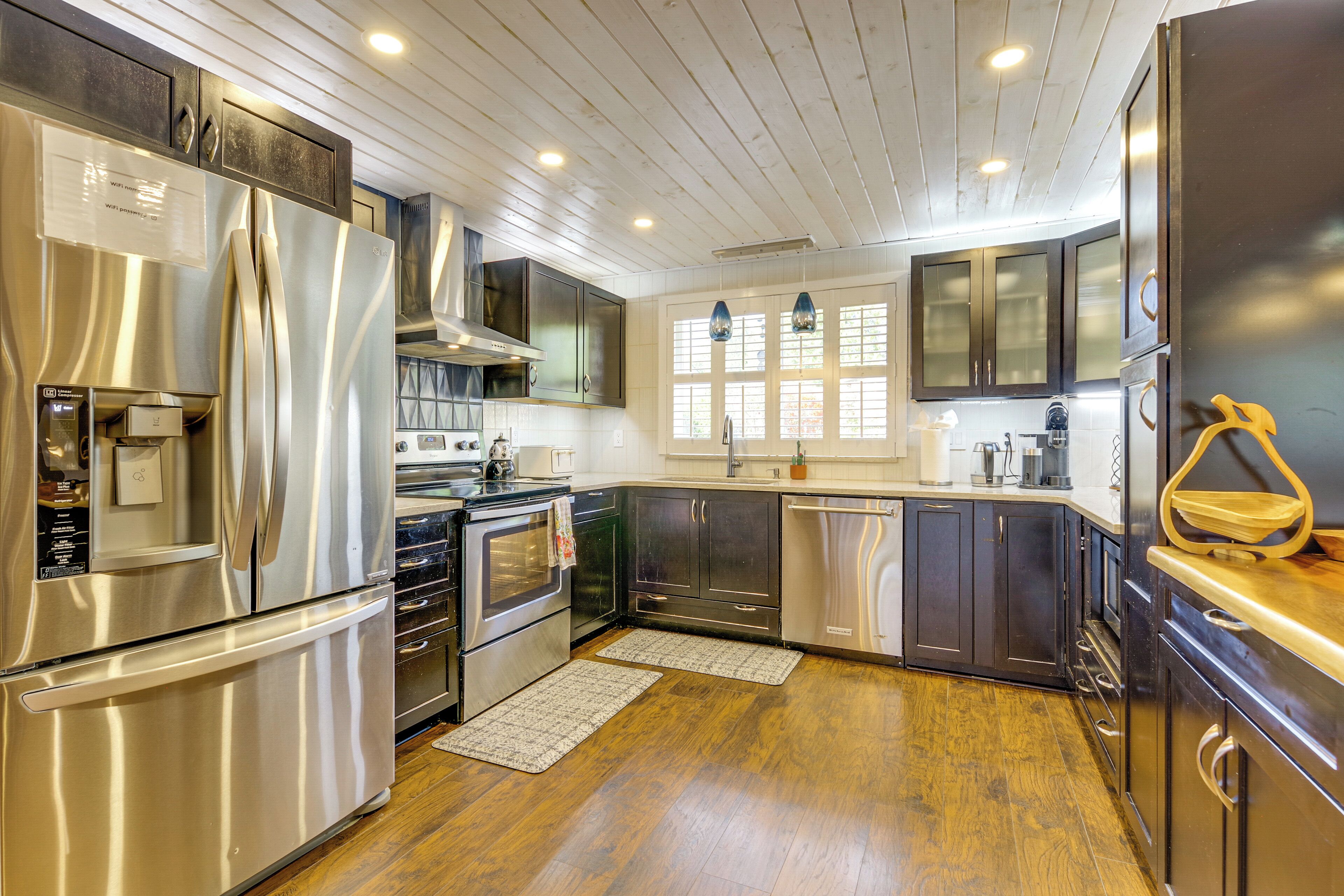 Dishwasher, coffee/tea maker, cookware/dishes/utensils, dining tables