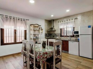 Deluxe Chalet, Patio, Garden View | Private kitchen | Full-sized fridge