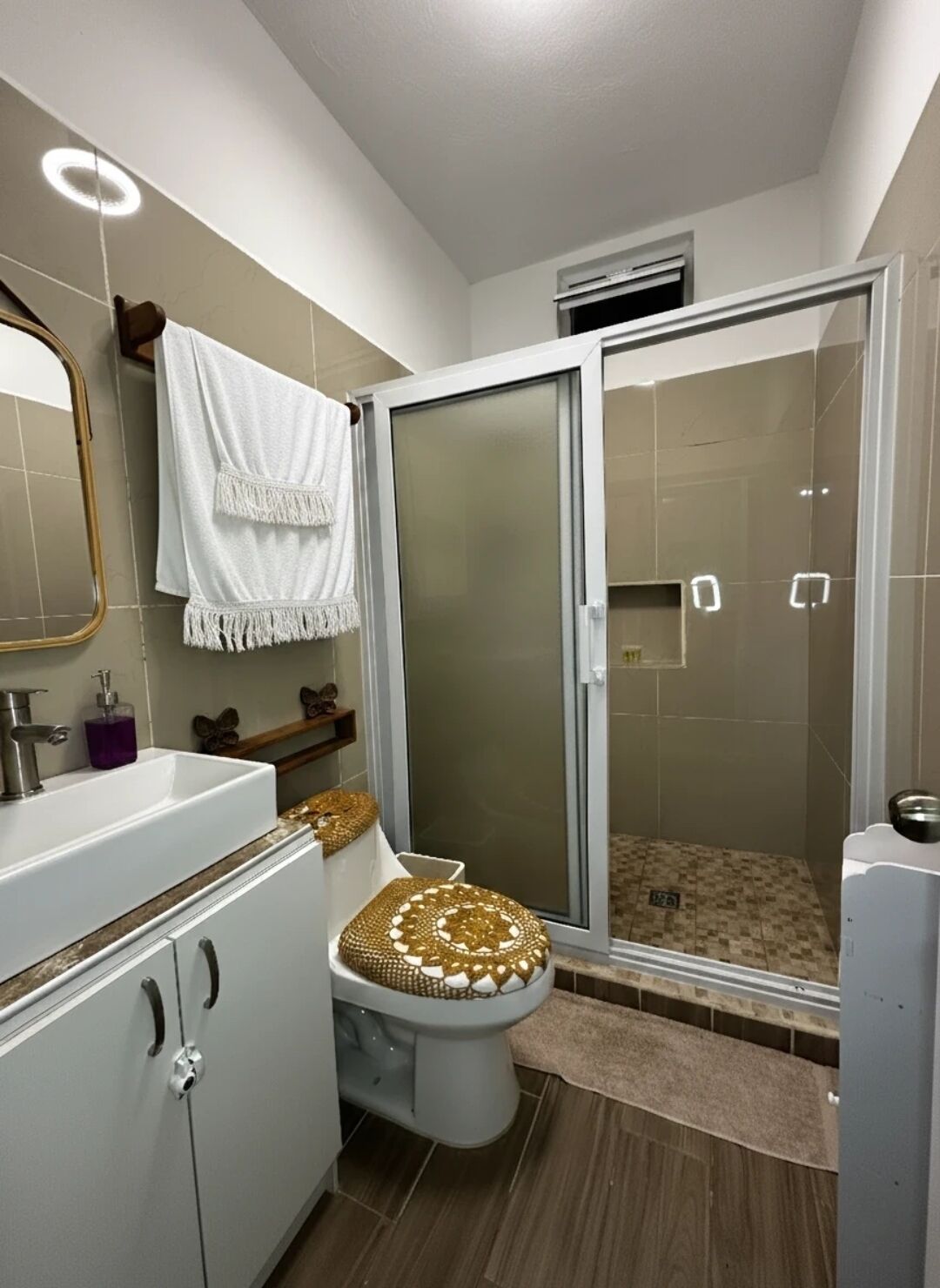 Shower, towels, soap, toilet paper