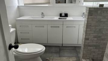 Shower, towels, soap, toilet paper