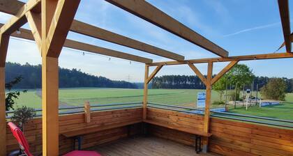 Cozy loam log with integrated wall heating, invites you to relax!