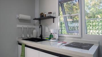 Microwave, stovetop, coffee/tea maker, cookware/dishes/utensils