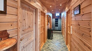 A wooden interior with a tiled floor, a bench, and a staircase leading to another level. - 4 bedroom gorgeous home in Rjukan (Rjukan)