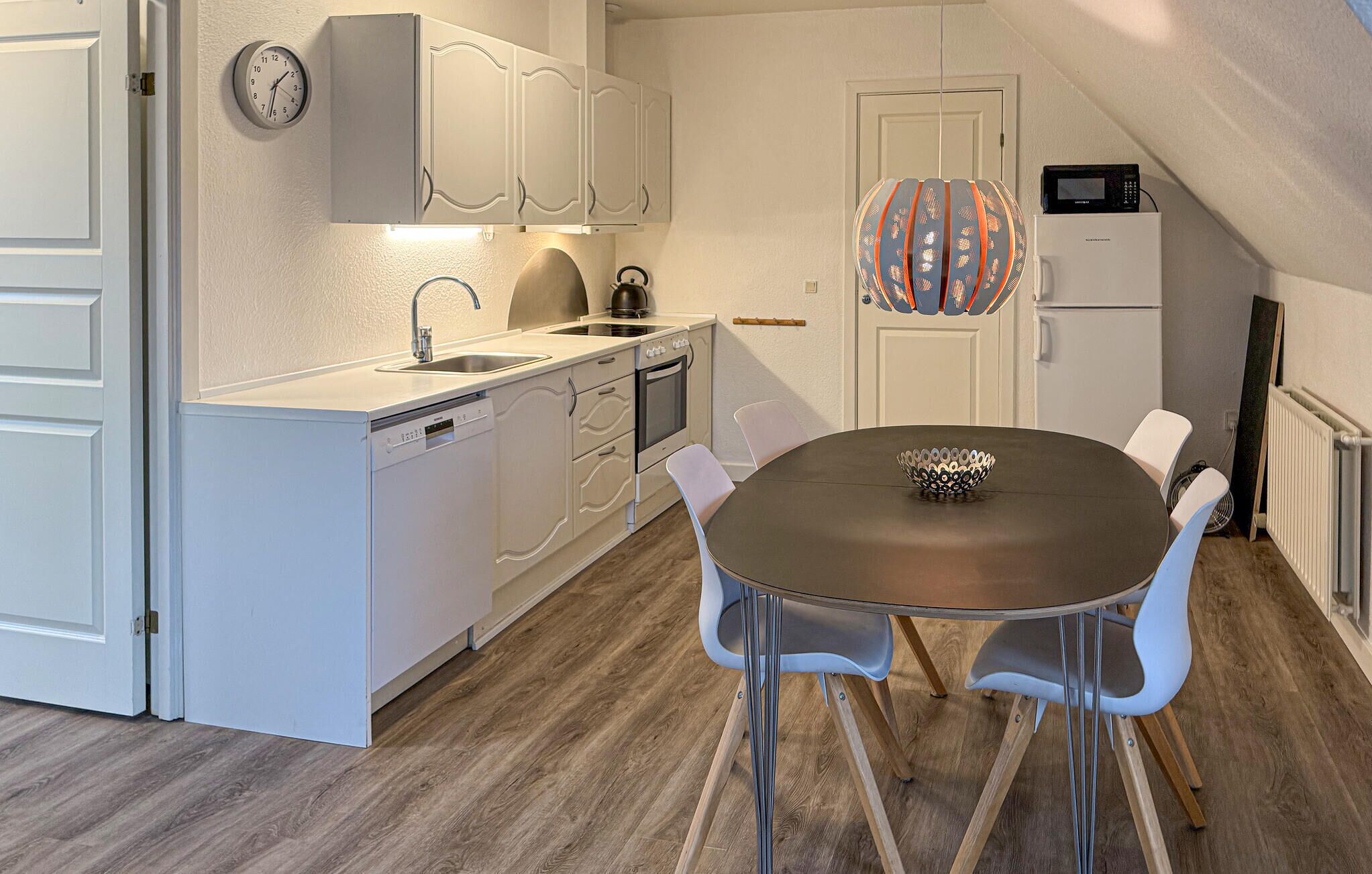 Fridge, stovetop, dishwasher, coffee/tea maker