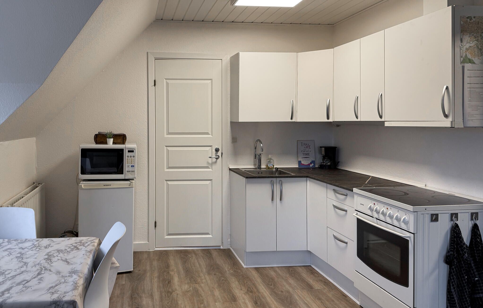 Fridge, stovetop, coffee/tea maker, cookware/dishes/utensils