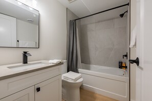 Hair dryer, towels, soap, toilet paper - Modern Luxury Basement Suite • Minutes From Falls (Niagara Falls)