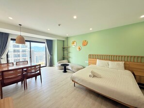 Deluxe Apartment, Balcony, Beach View | Desk, laptop workspace, blackout drapes, free WiFi