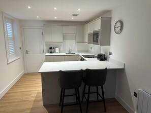 Fridge, microwave, oven, stovetop - 59 Whitstable -  One Bedroom Ground Floor Flat (Whitstable)