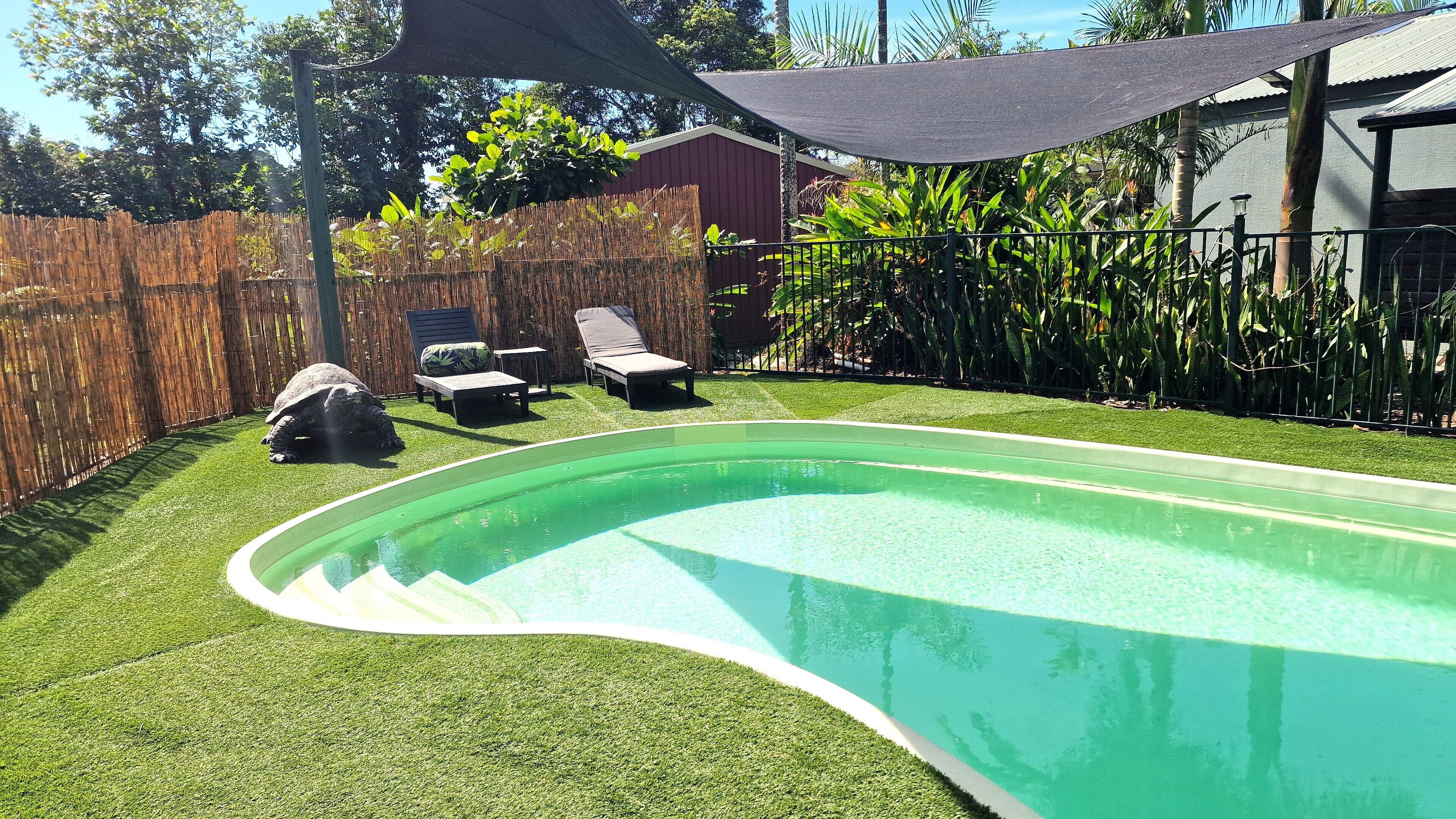 Outdoor pool, open 8:00 AM to 8:00 PM, pool loungers