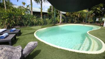 Outdoor pool, open 8:00 AM to 8:00 PM, pool loungers