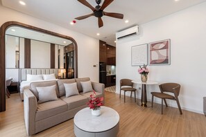 Luxury Single Room, Kitchenette | Living area | 45-inch flat-screen TV with cable channels