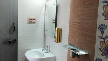 Shower, towels, soap, toilet paper