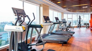 A gym with treadmills, exercise bikes, and weight machines. - Grand Palace Sylhet (Sylhet)