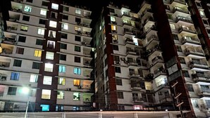 A multi-story building with illuminated windows and balconies, a sign for 'World Beach Resort', and a 'Snoqo Medical Point' sign. - World Beach Resort Cox's Bazar (Cox's Bazar)