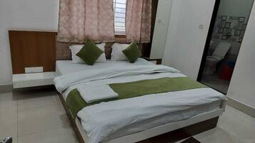 Premium bedding, down duvets, desk, laptop workspace