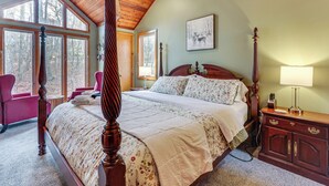 A bedroom with a four-poster bed, a wooden ceiling, and large windows. - Grand Wintergreen Resort Home w/ Hot Tub! (Nellysford)