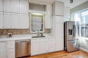 Microwave, dishwasher, coffee/tea maker, dining tables