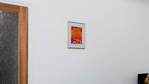 A framed poster on a white wall. - Spacious 3 BED House With Parking (Bo'ness)