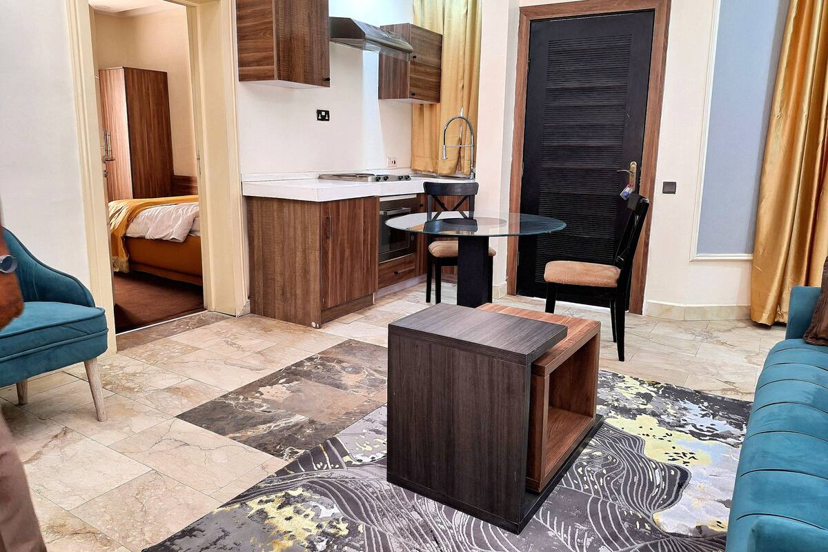 Luxury Suite, City View | In-room safe, desk, laptop workspace, iron/ironing board