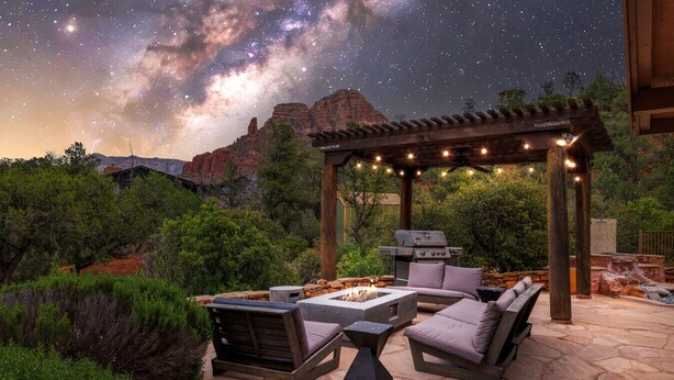 An outdoor patio with a pergola, fire pit, grill, and seating area. - Luxe Red Rock Views, Heated Pool & Spa, Hot tub (Sedona)