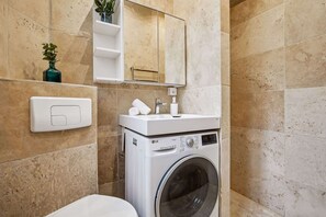 Shower, hair dryer, towels, soap