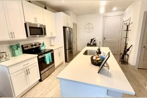 Fridge, microwave, dishwasher, coffee/tea maker