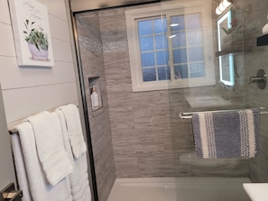 Shower, hair dryer, towels, soap