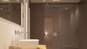 A modern bathroom with a large white sink, wooden countertop, and a glass-enclosed shower area. - Luxury Freedom Apollo (Palermo)