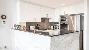 Coffee/tea maker, fridge, microwave, oven