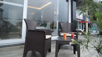 Suite, 1 Bedroom, Balcony, City View | Living area | 32-inch Smart TV with digital channels