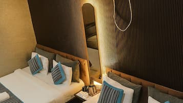 Deluxe Quadruple Room, Balcony | Minibar, desk, laptop workspace, blackout drapes