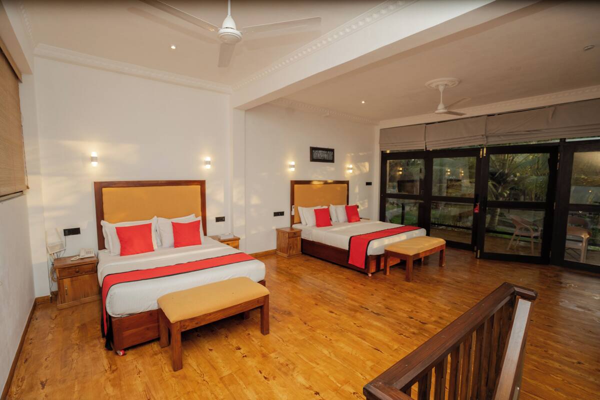 Habitación cuádruple Deluxe, vista al océano | Terraza o patio