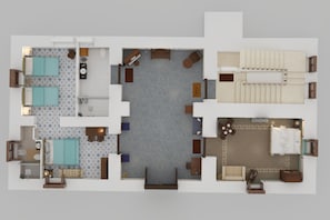 Un plan d’aménagement de chambre d’hôtel comprenant une salle de bain, un espace de vie avec un canapé et une table basse, et un coin repas avec une table et des chaises.