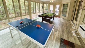 A room with a ping pong table, a pool table, and a ceiling fan. - Sosegado Place Hot springs Village (Hot Springs Village)