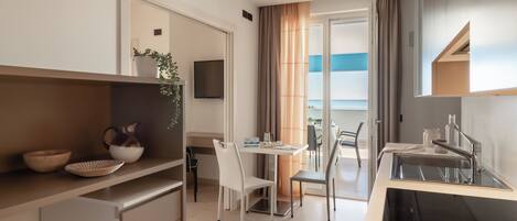 Deluxe Studio, 1 Double Bed, Sea View | Living area | 32-inch LCD TV with satellite channels, heated floors