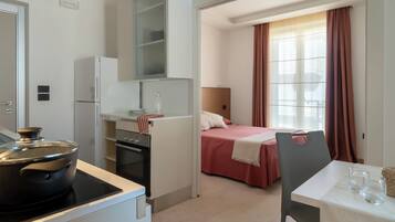 Estúdio luxo, 1 cama de casal, vista para o mar | Área de estar