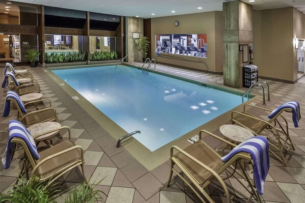 A swimming pool with lounge chairs and a treadmill. - Near PHL Airport + Free Shuttle. Dining. Pool. (Philadelphia)