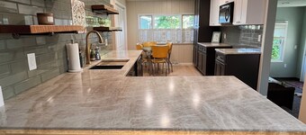 Charming 4-bedroom home with private beach park. Large patio and driveway.