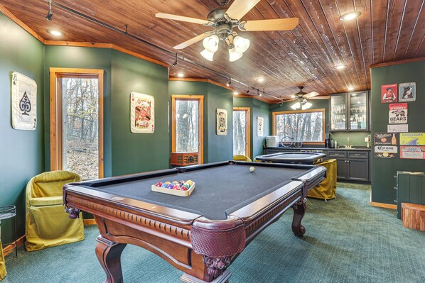 A pool table with a ball rack, a ceiling fan, and framed artwork on the walls. - Grand Wintergreen Resort Home w/ Hot Tub! (Nellysford)