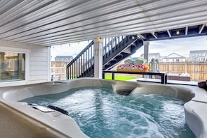 A hot tub area with a wooden deck, a staircase, and a view of houses in the background. - 8 Mi to Usafa! Hot Tub Haven in Colorado Springs (Colorado Springs)