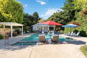 A backyard with a swimming pool, lounge chairs, and a covered patio area. - Luxury LA Garden Estate Private Pool Hottub Tennis (La Habra)